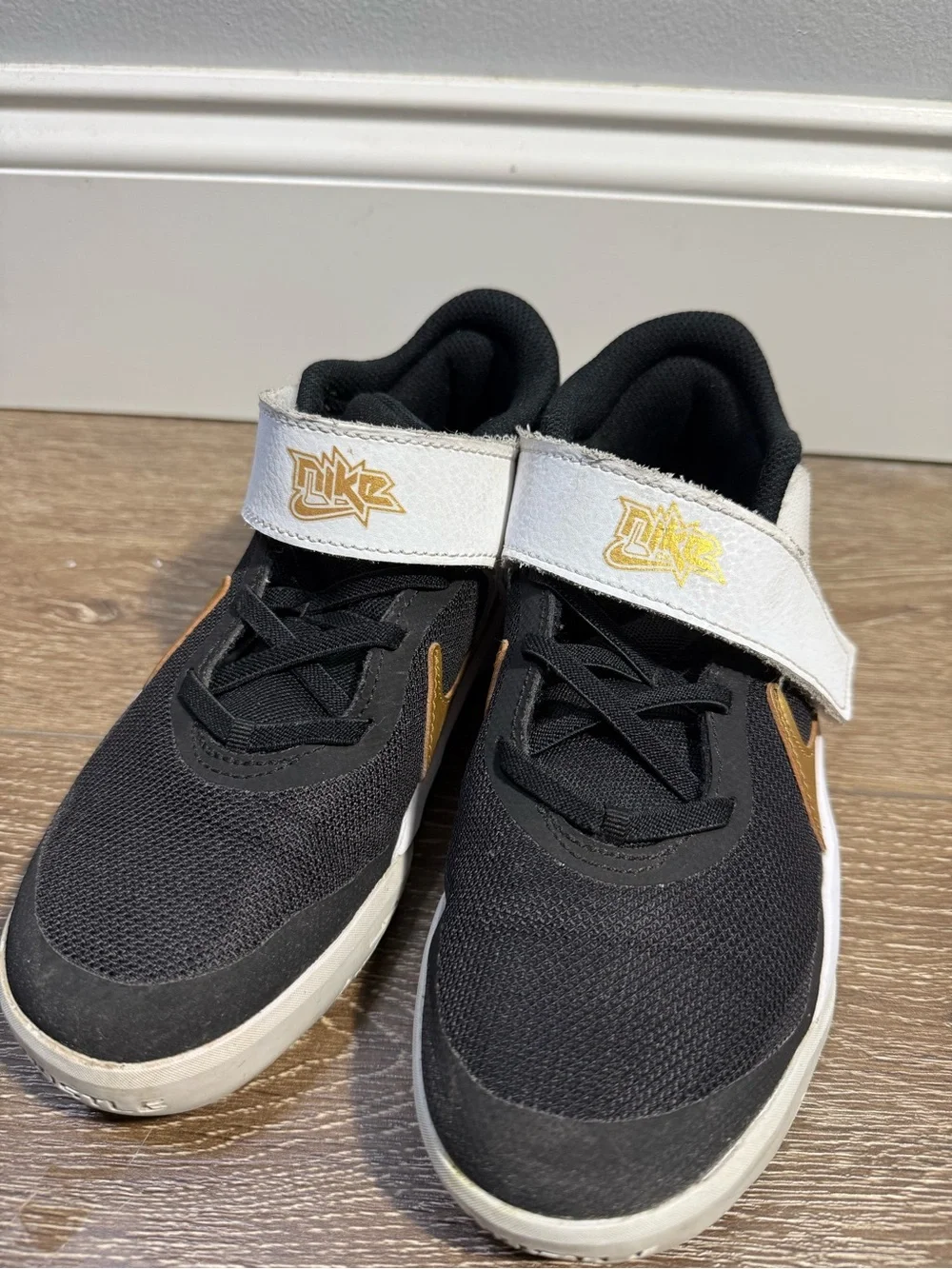 Nike Kids Black, White and Gold Velcro Strap Sneakers